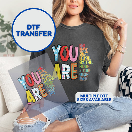 DTF transfer of "YOU ARE ENOUGH" text art with uplifting words.